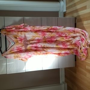 Badgley Mischka dress. Multi color flowing . Open cut shoulders . Beaded detail.